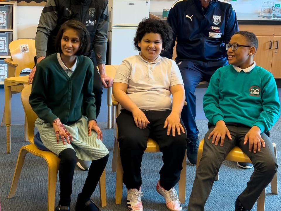 Brunt & Robertson with pupils