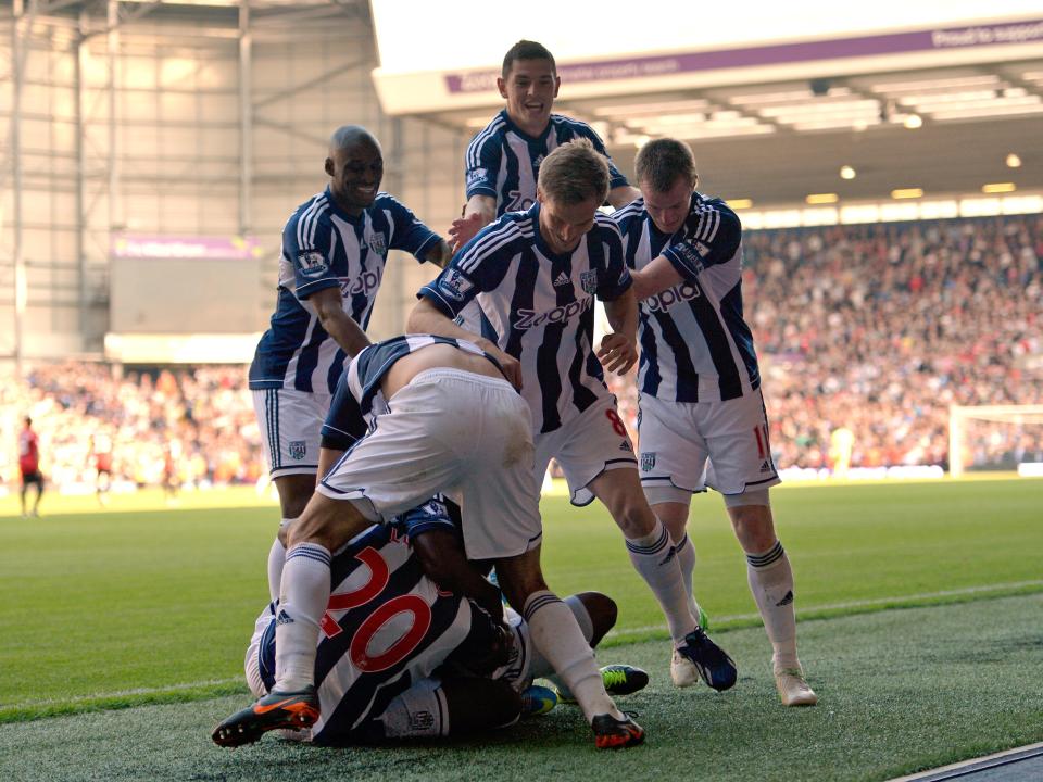 Albion players celebrate scoring against Man Utd in 2013
