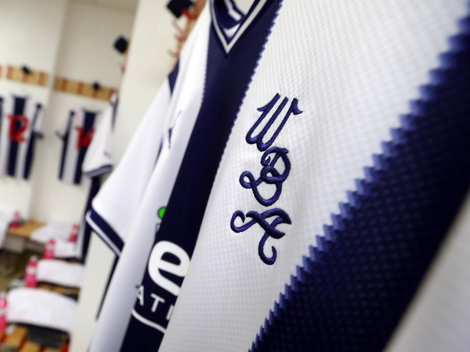 A WBA badge on the 2022/23 home shirt