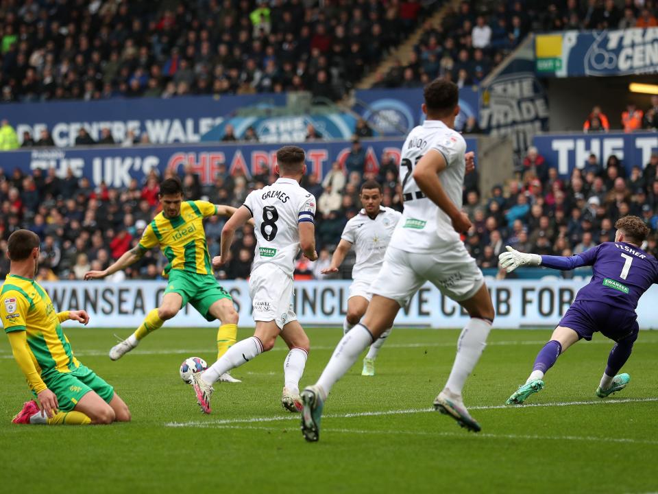 An image of Okay Yokuslu scoring against Swansea