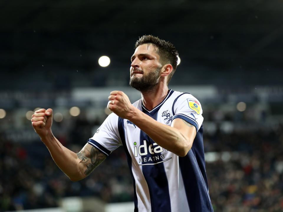 An image of Okay Yokuslu celebrating a goal