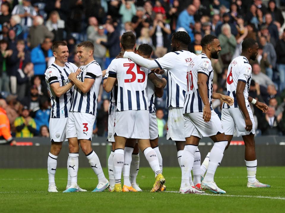 Albion players celebrate their second goal against Swansea 