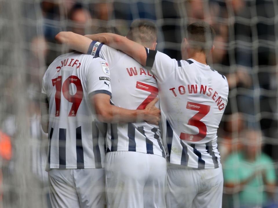 John Swift celebrates scoring against Swansea with Jed Wallace and Conor Townsend 