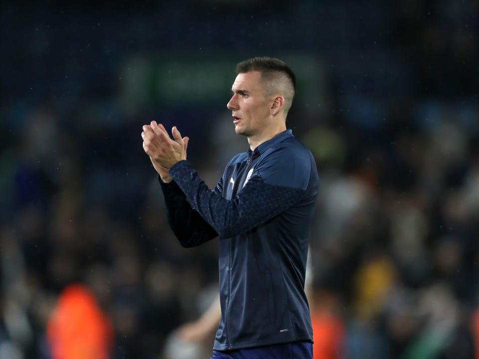 Jed Wallace applauds the away fans at Elland Road