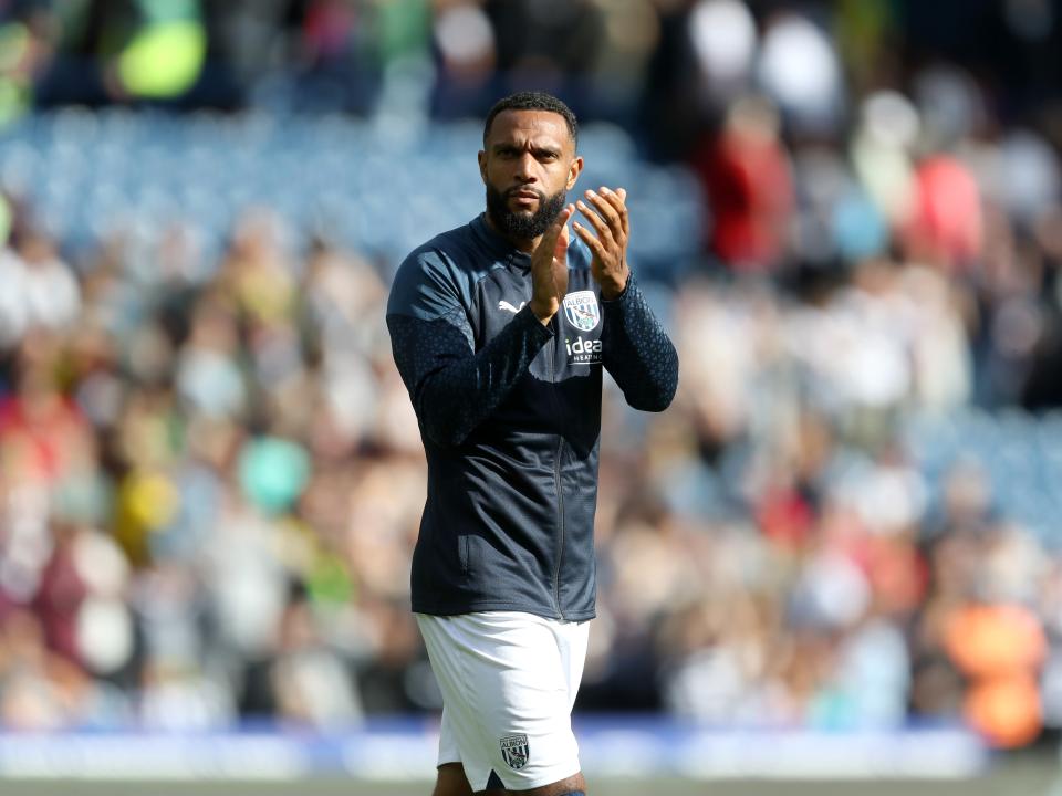 Matt Phillips applauds the fans at full time