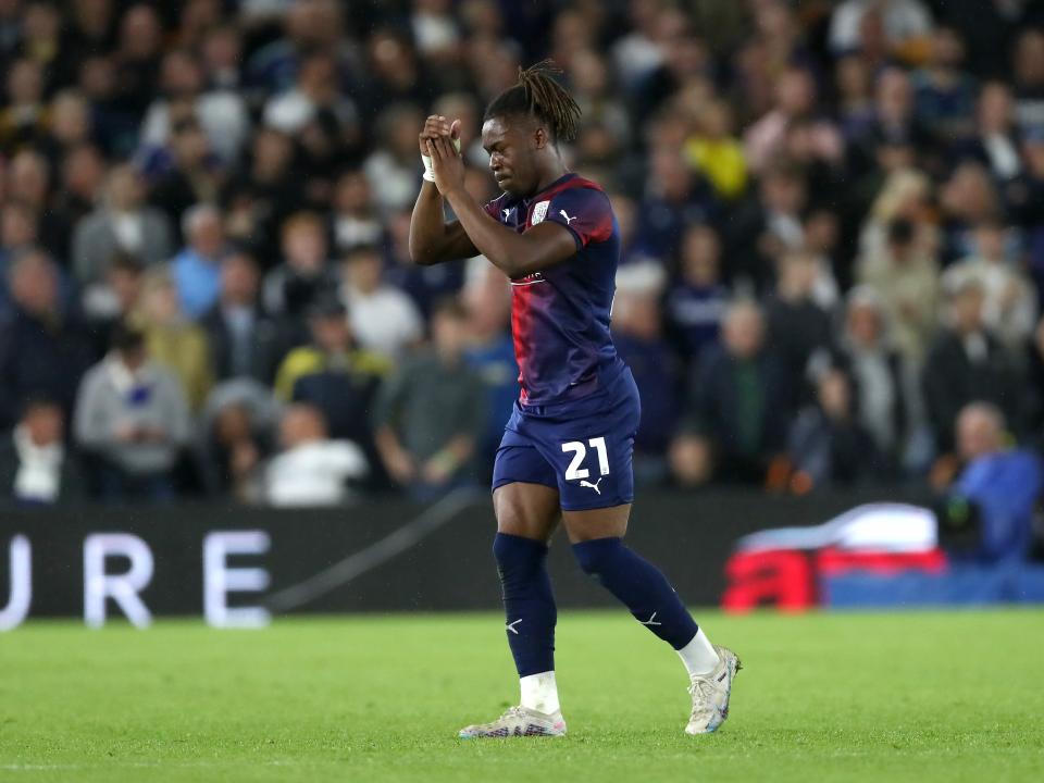 Brandon Thomas-Asante applauds the away fans at Elland Road