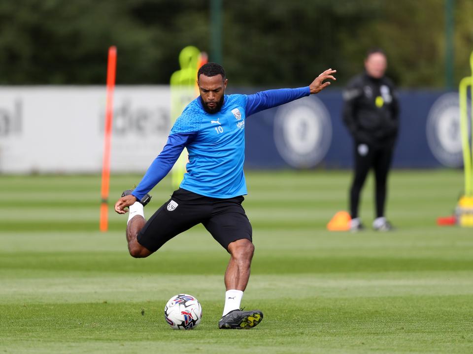 Matt Phillips strikes the ball in training 