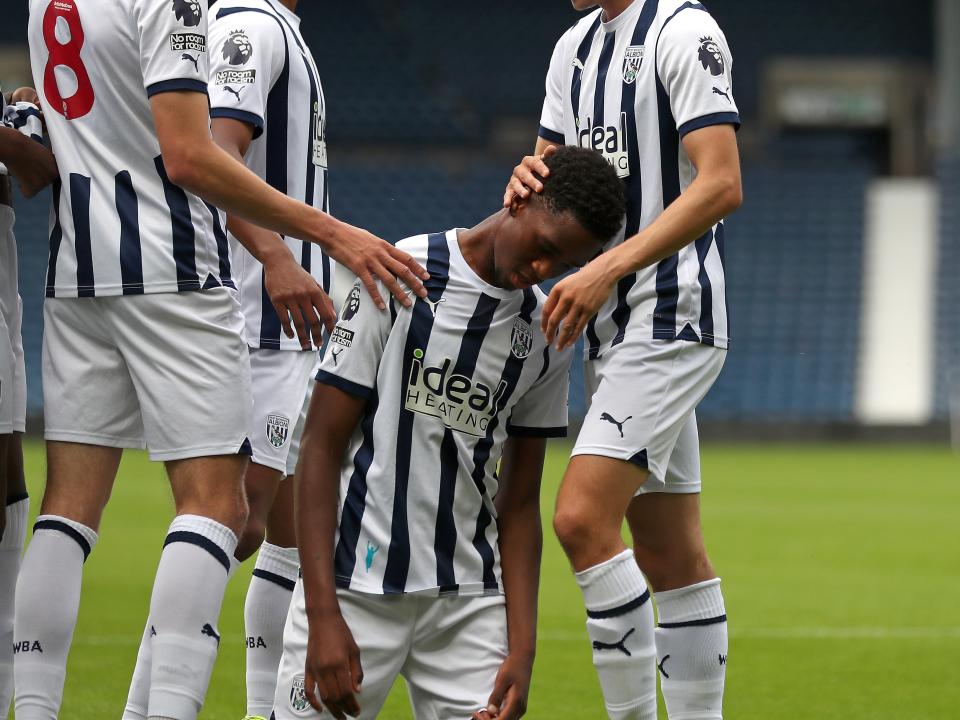 Kevin Mfuamba celebrates with his team-mates after scoring against Blackburn in PL2