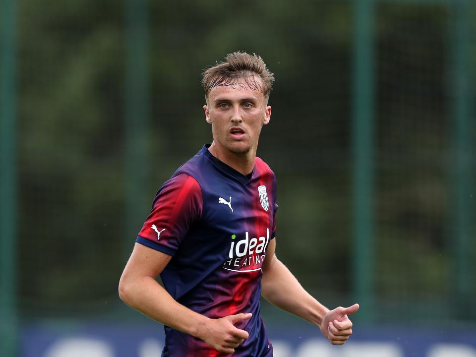 Jamie Andrews in action wearing the blue and red away kit