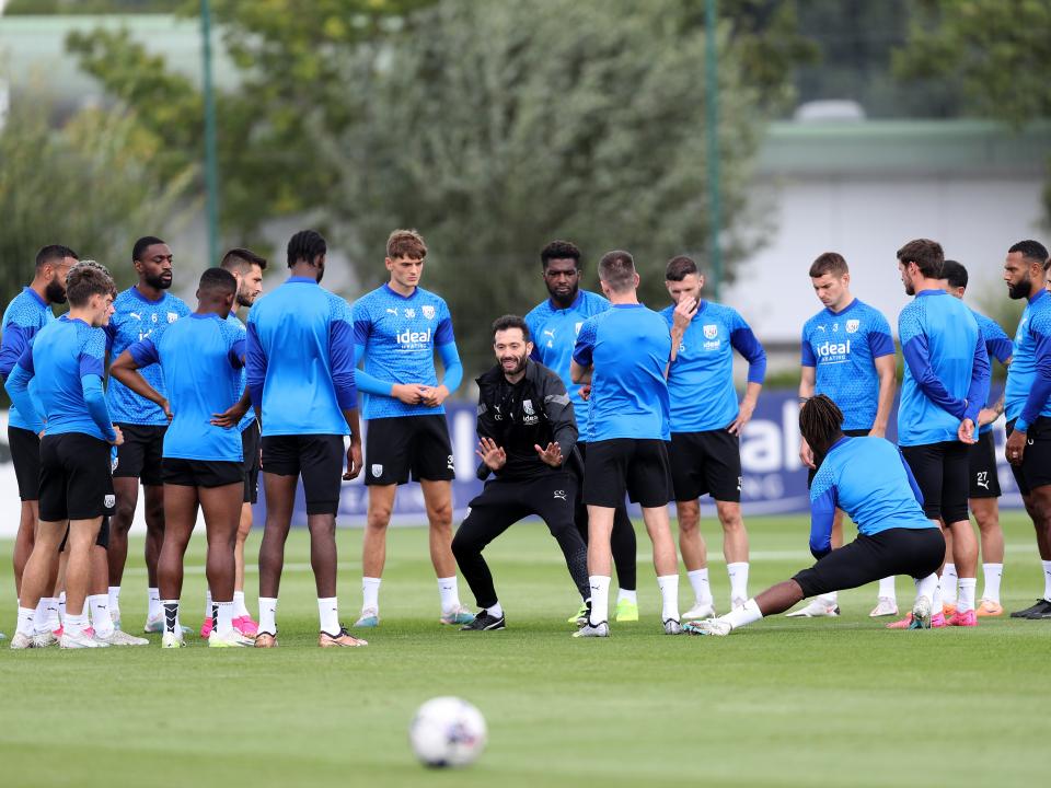 Carlos Corberan delivers info to his squad during training