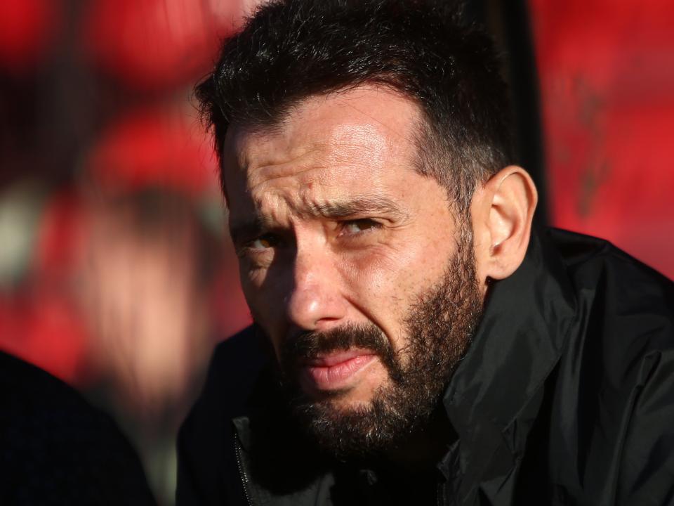 Carlos Corberán stares at the camera 