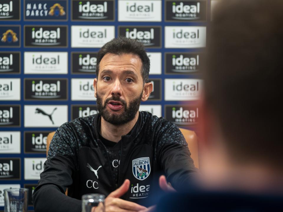 Carlos Corberan talks to journalists in a press conference