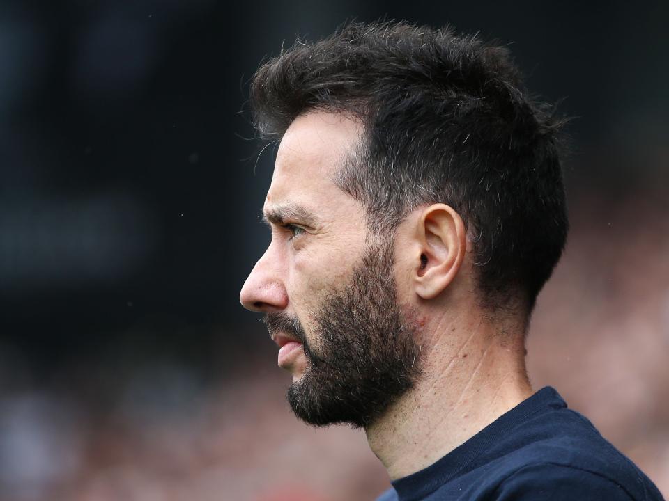 An image of the left side of Carlos Corberán's head