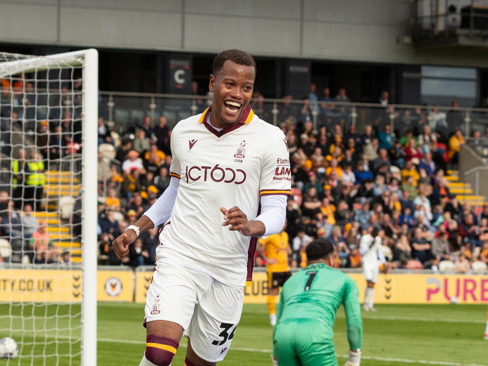 A photo of Albion youngster Ray Tulloch celebrating scoring a goal for loan side Bradford against Newport in their white away colours