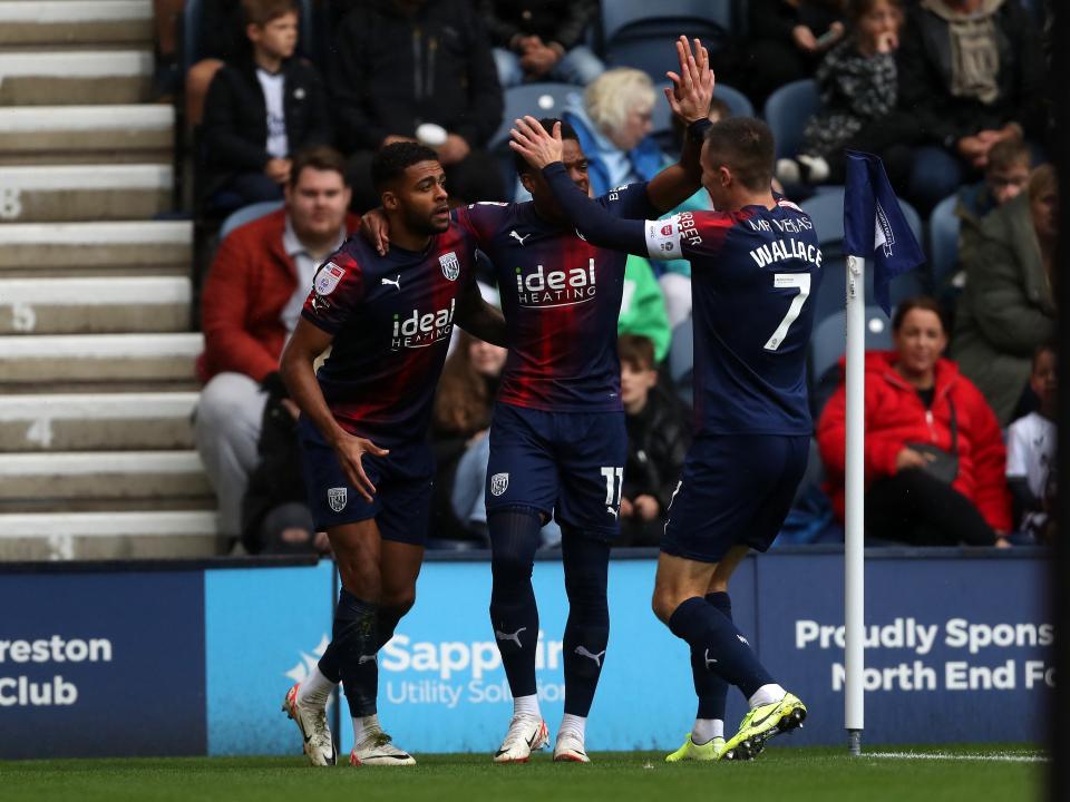 Darnell Furlong celebrates scoring against Preston with Grady Diangana and Jed Wallace