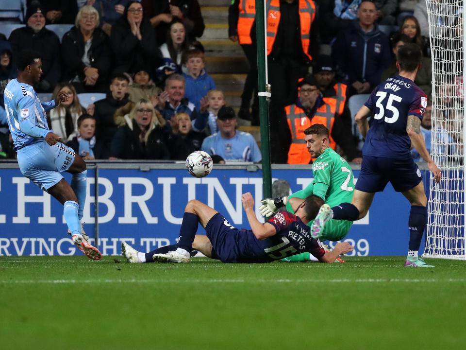 Erik Pieters and Alex Palmer deny Haji Wright a goal