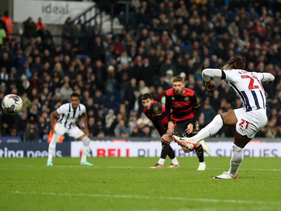 Brandon Thomas-Asante taking a penalty against QPR