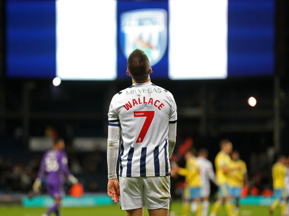 Jed Wallace looking up at the sky with his name and number showing on the back of his shirt