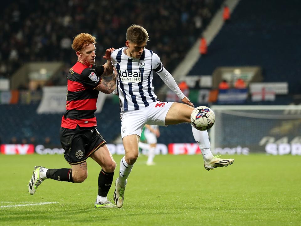 Tom Fellows fights for the ball