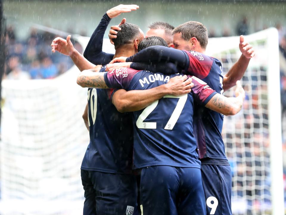 Matty Phillips celebrates scoring against Preston with his team-mates