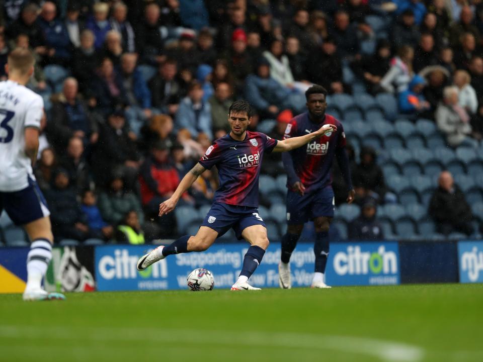 Okay Yokuslu passes the ball against Preston