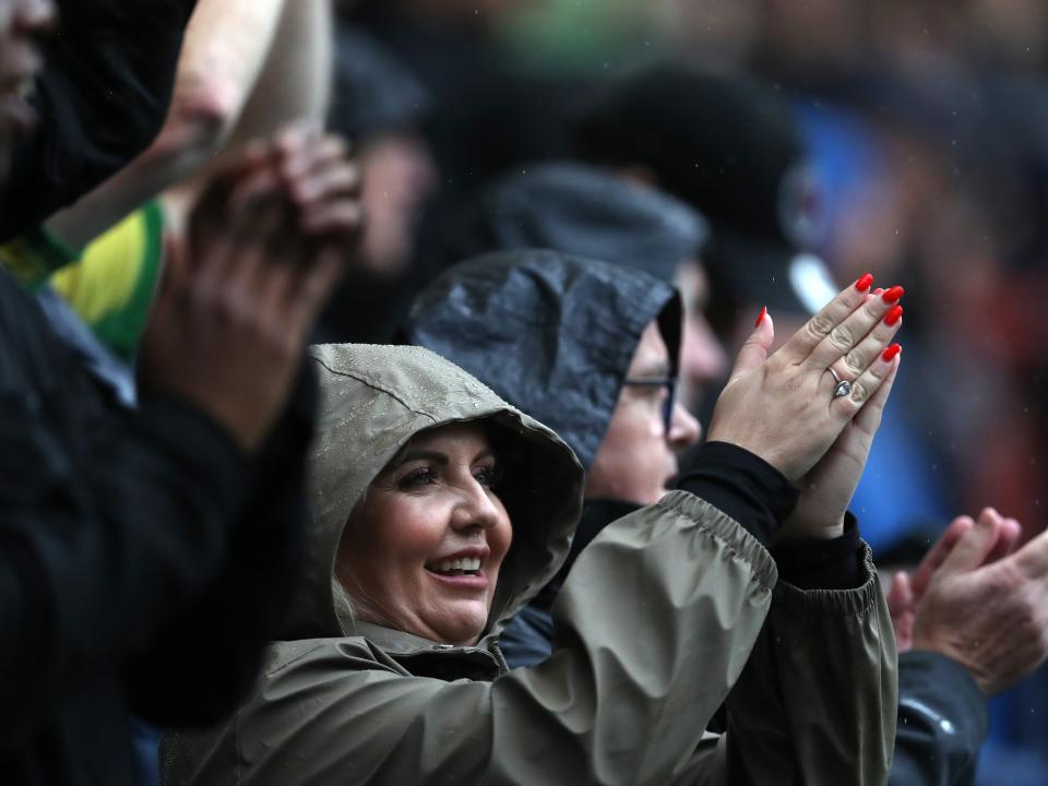 A female Albion fan clapping