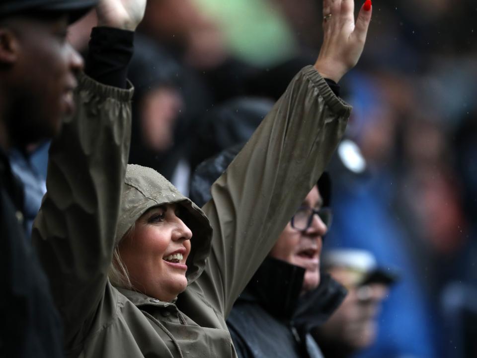 A female Albion fan cheering