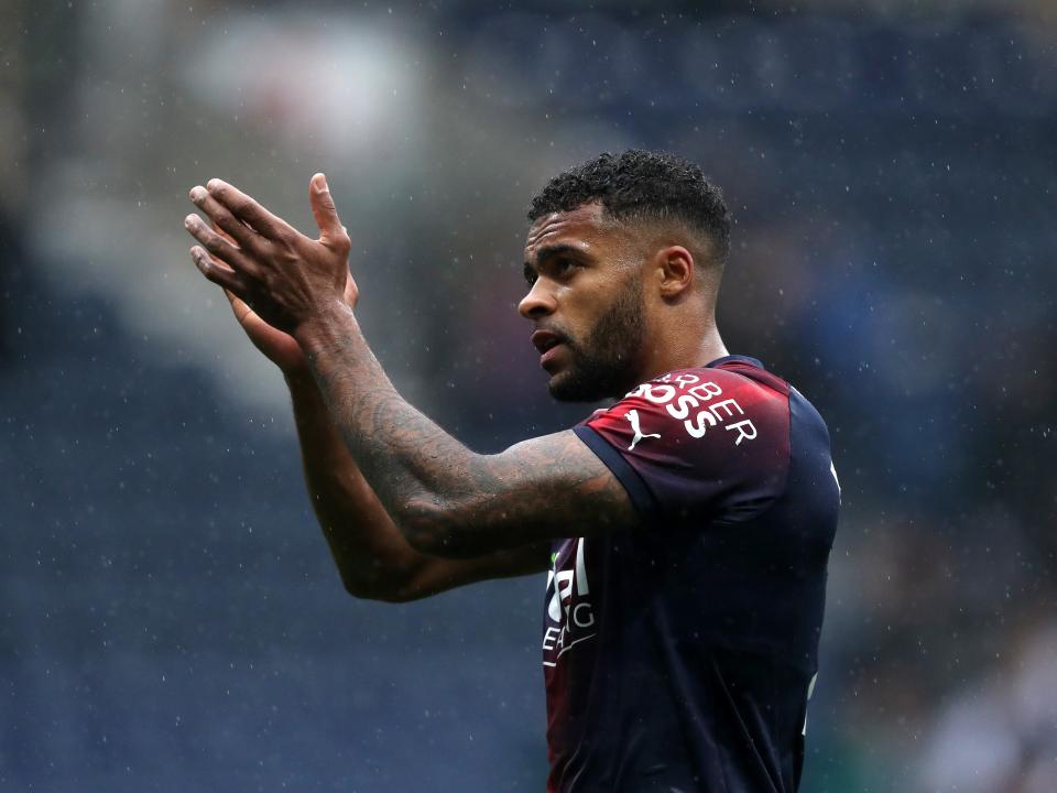 Darnell Furlong applauds supporters at Preston