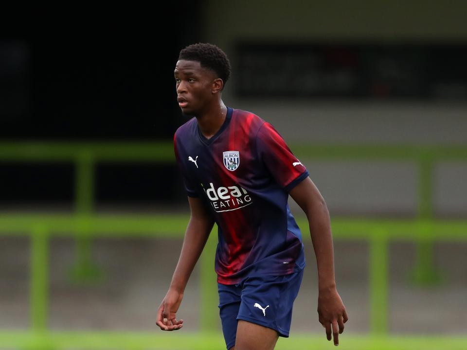A photo of Kevin Mfuamba in red and blue away colours