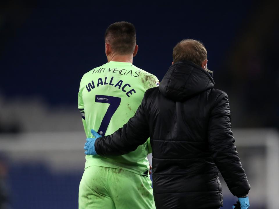 Jed Wallace walks off the pitch injured clutching his arm