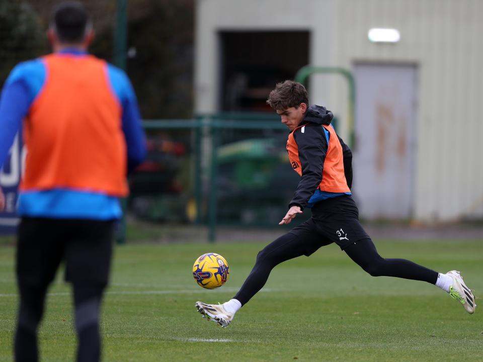Tom Fellows strikes the ball in training 