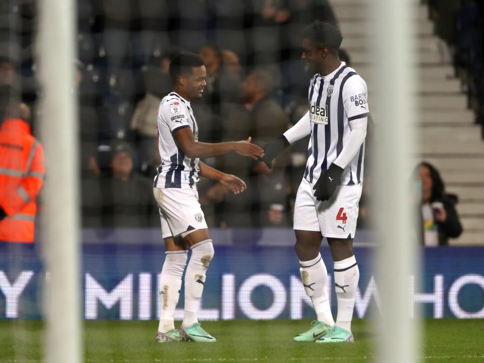 Grady Diangana celebrates scoring against Ipswich with Cedric Kipre