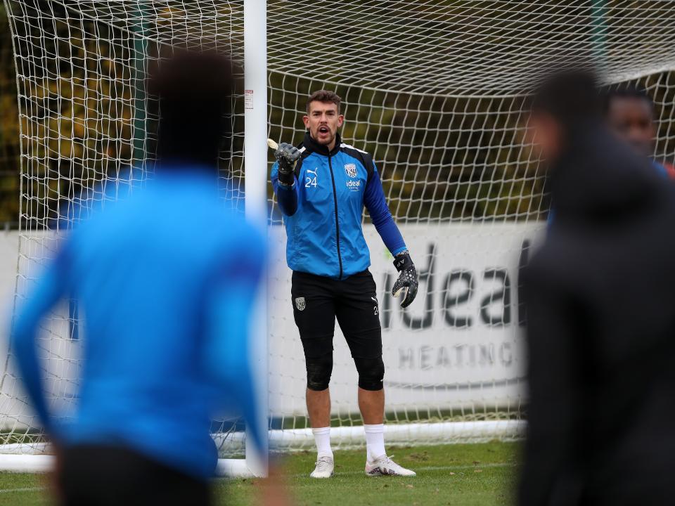 Alex Palmer by his goalpost in training 