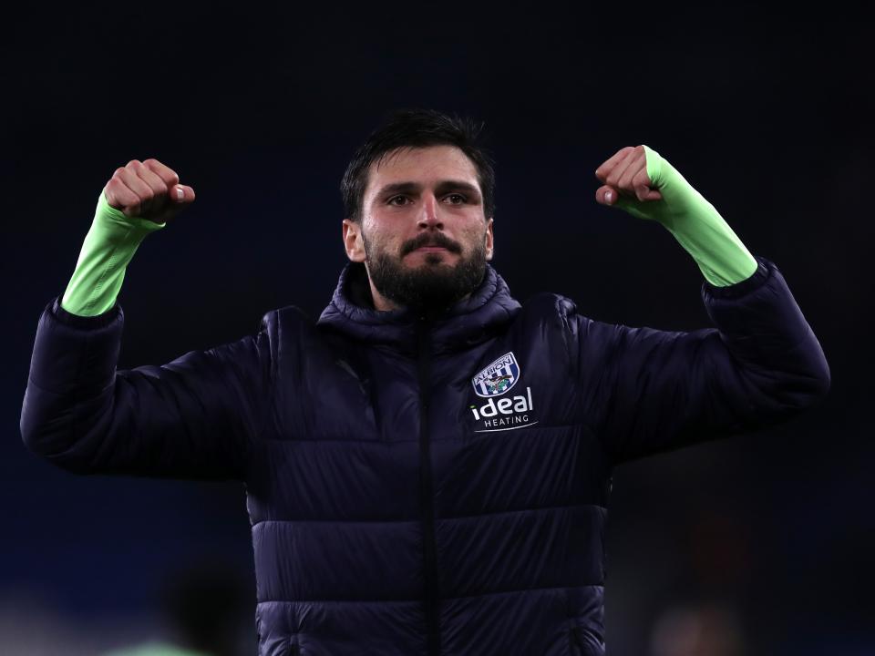 Okay Yokuslu applauds the travelling fans at full-time