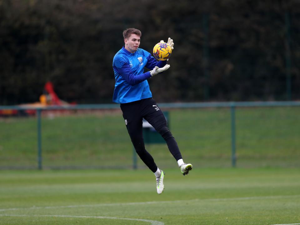 Josh Griffiths catching the ball in training 