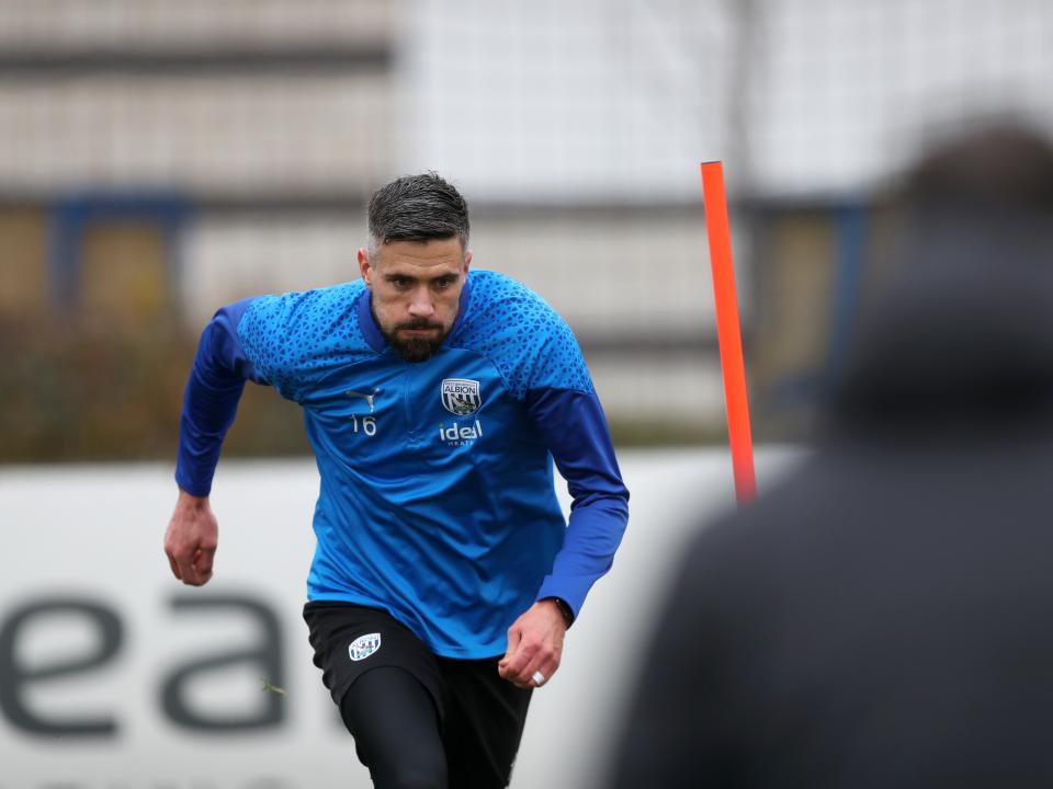 Martin Kelly running forwards in training 