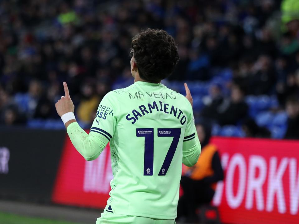 Jeremy Sarmiento celebrates scoring against Cardiff by pointing to sky with his name and number on show facing away from the camera 