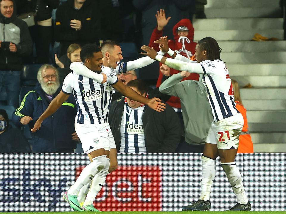 An image of Diangana, Wallace and Thomas-Asante celebrating
