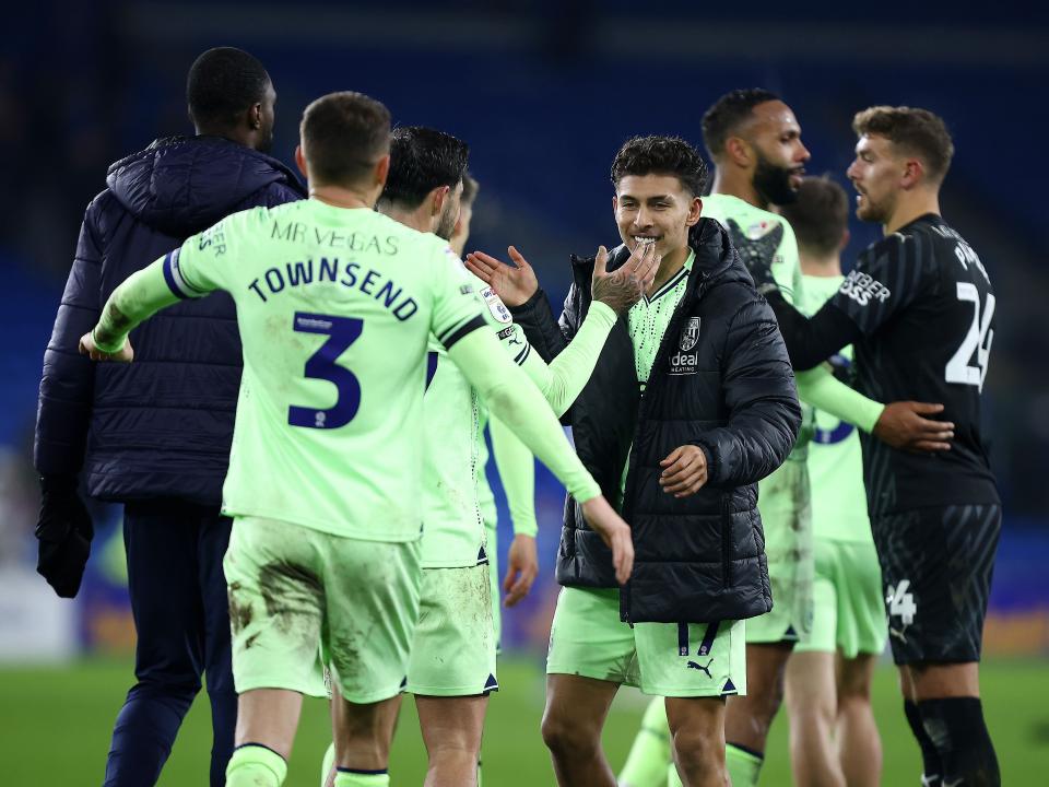 A group of Albion players celebrate the win at full-time