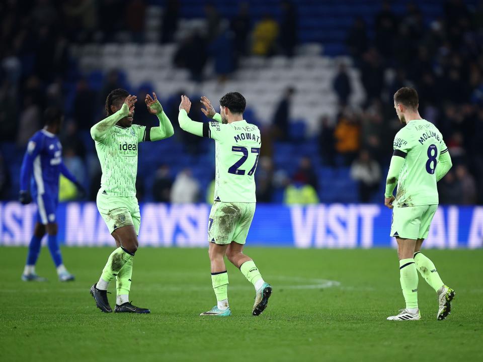 A group of Albion players celebrate the win at full-time