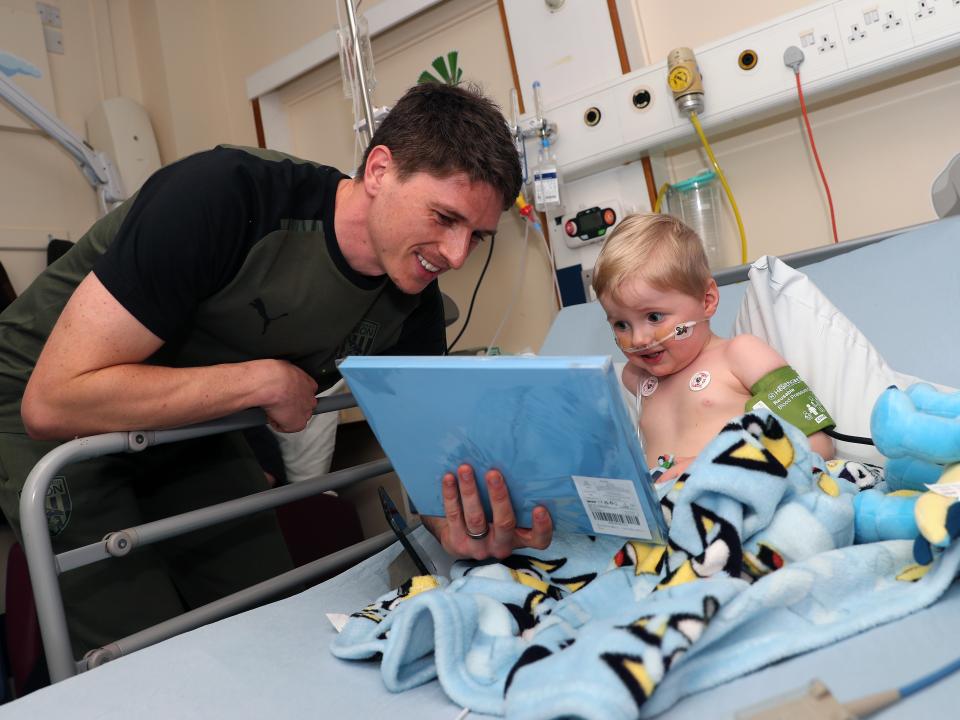 Adam Reach meets a young patient at Sandwell General Hospital