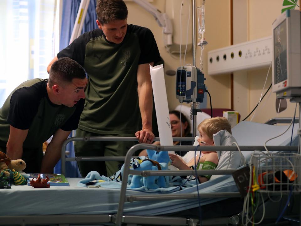 Jed Wallace meets a young patient at Sandwell General Sandwell Hospital