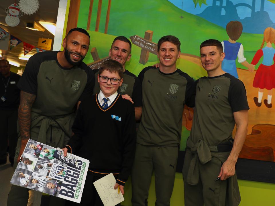 Kyle Bartley, Conor Townsend, Adam Reach and Jed Wallace pose for a photo with patients at Sandwell General Hospital