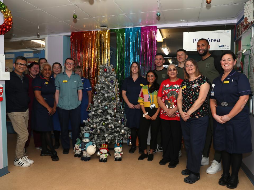 Kyle Bartley, Conor Townsend, Adam Reach and Jed Wallace pose for a photo with NHS workers at Sandwell General Hospital