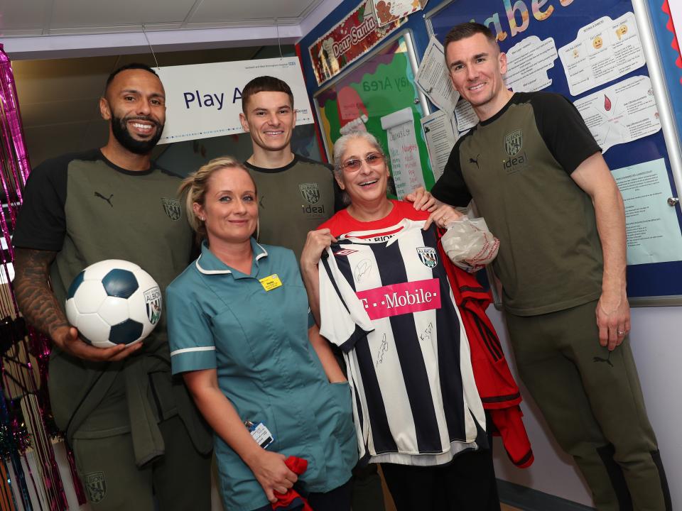 Kyle Bartley, Conor Townsend and Jed Wallace pose for a photo with NHS workers at Sandwell General Hospital