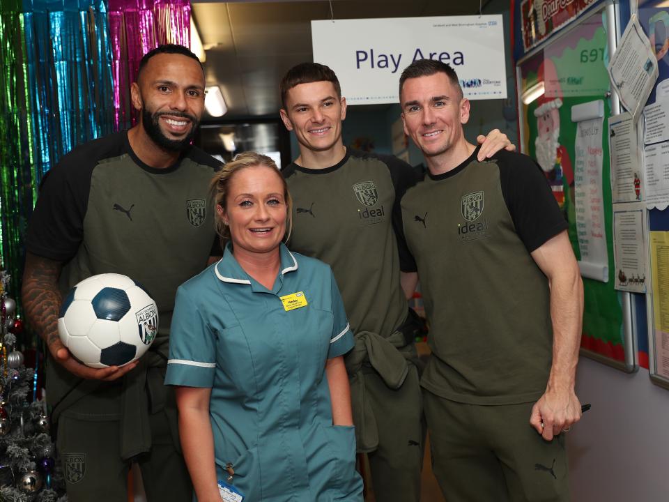 Kyle Bartley, Conor Townsend and Jed Wallace pose for a photo with NHS workers at Sandwell General Hospital