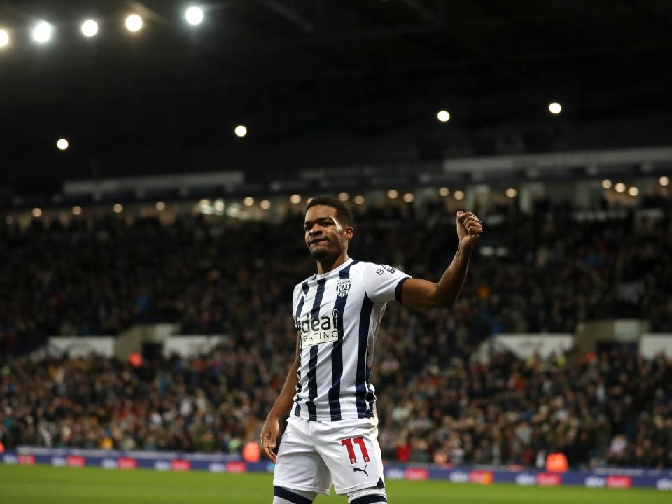 Grady Diangana waves to supporters during the game against Leeds