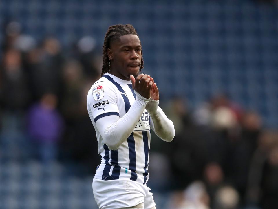 Brandon Thomas-Asante applauds supporters after the Stoke game