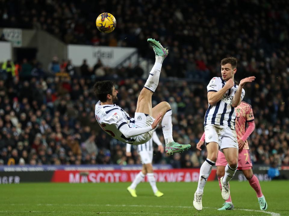 Okay Yokuslu attempts an acrobatic shot against Leeds