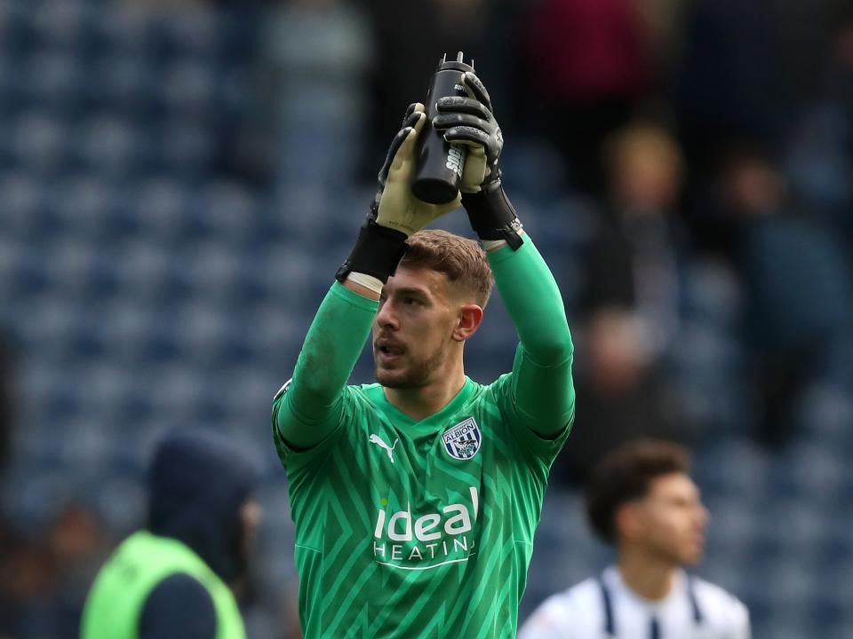 Alex Palmer applauds supporters after the Stoke game